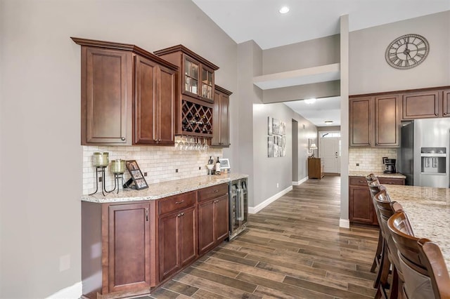 40 Burnside Ct, Frontier Township, MO 63303 - kitchen with stainless steel refrigerator with ice dispenser, wine cooler, baseboards, decorative backsplash, and dark wood-type flooring