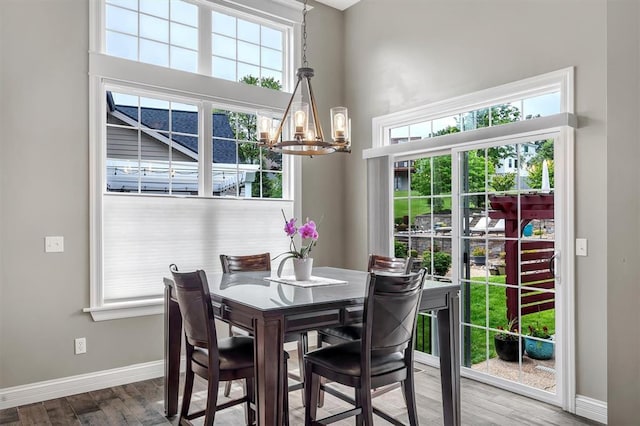 40 Burnside Ct, Frontier Township, MO 63303 - dining space with a chandelier, baseboards, and wood finished floors