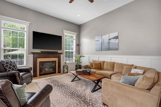 40 Burnside Ct, Frontier Township, MO 63303 - living area with a decorative wall, ceiling fan, a high end fireplace, and a wainscoted wall