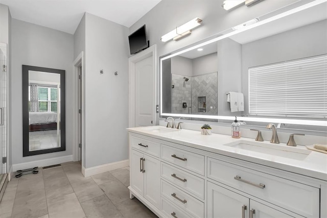 40 Burnside Ct, Frontier Township, MO 63303 - bathroom with a shower stall, baseboards, double vanity, and ensuite bathroom