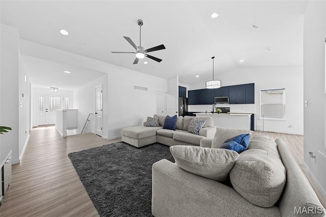 203 Homestretch Ln, Wentzville, MO 63385 - living room featuring light wood finished floors, lofted ceiling, recessed lighting, and a ceiling fan