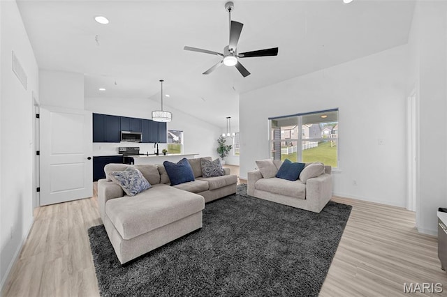 203 Homestretch Ln, Wentzville, MO 63385 - living area featuring light wood-style flooring, vaulted ceiling, healthy amount of natural light, ceiling fan, and recessed lighting