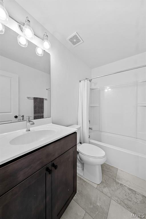 203 Homestretch Ln, Wentzville, MO 63385 - bathroom featuring vanity and shower / bath combo with shower curtain
