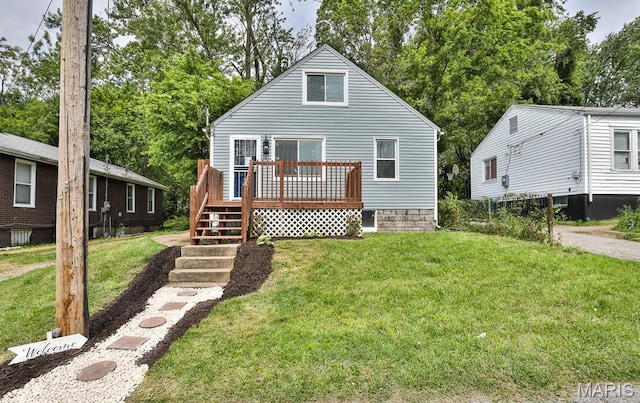5333 Helen Ave, Jennings, MO 63136 - rear view of property featuring a deck, a lawn, stairs, and view of wooded area