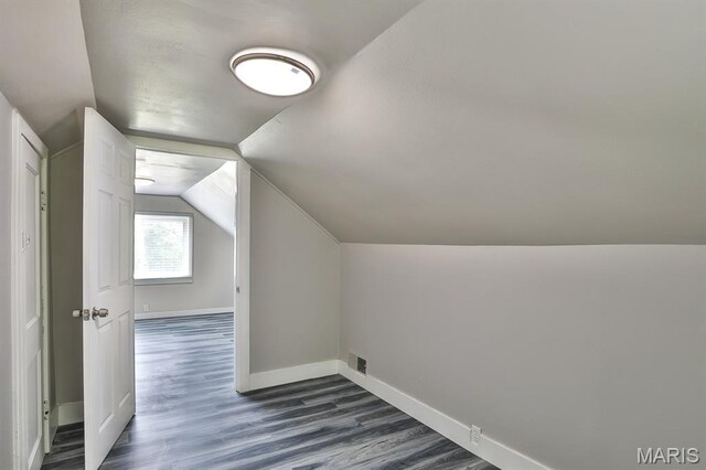 5333 Helen Ave, Jennings, MO 63136 - bonus room with dark wood-style flooring, baseboards, and lofted ceiling