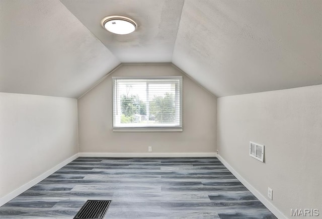 5333 Helen Ave, Jennings, MO 63136 - bonus room with wood finished floors, lofted ceiling, a textured ceiling, and baseboards