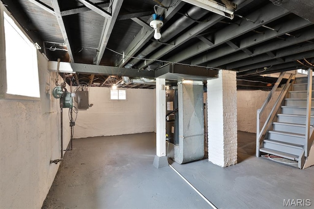 5333 Helen Ave, Jennings, MO 63136 - basement featuring stairs, heating unit, and electric panel