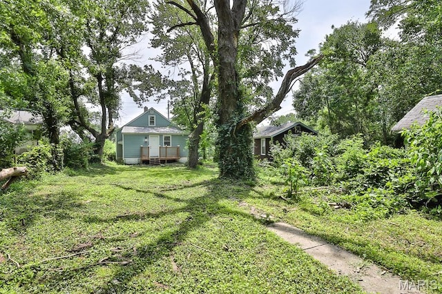 5333 Helen Ave, Jennings, MO 63136 - view of green lawn featuring a wooden deck