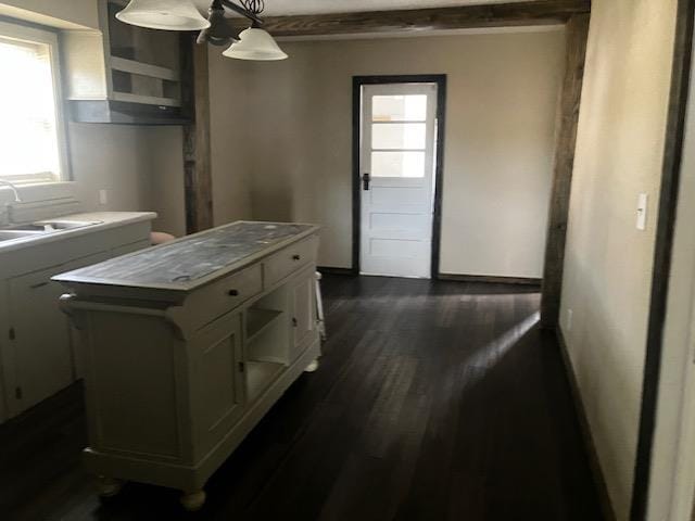 423 W Mckinley Ave, Bernie, MO 63822 - kitchen featuring white cabinets, dark wood-style flooring, a sink, hanging light fixtures, and open shelves