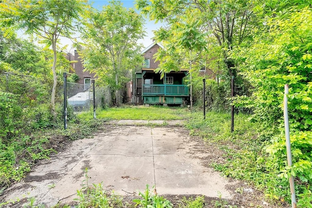 exterior space with fence and covered porch