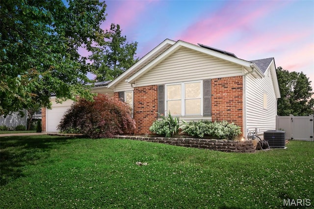 104 Maywood Ct, Saint Peters, MO 63376 - property exterior at dusk with brick siding and an attached garage
