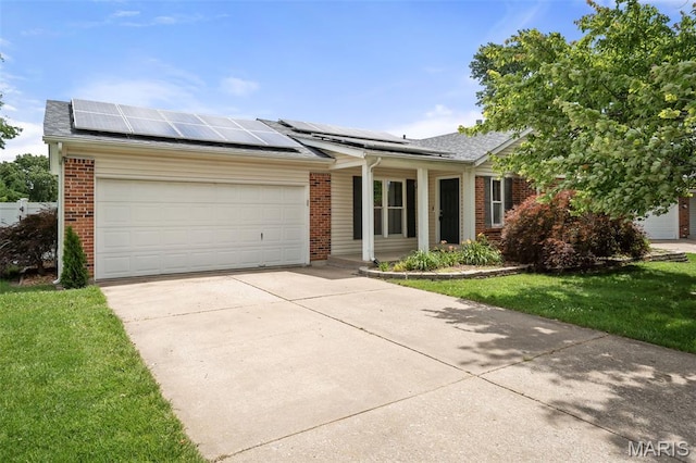 104 Maywood Ct, Saint Peters, MO 63376 - single story home with brick siding, a garage, concrete driveway, and roof mounted solar panels
