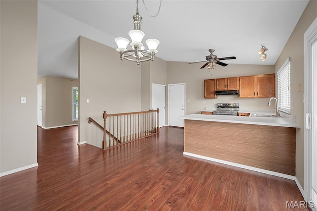 104 Maywood Ct, Saint Peters, MO 63376 - kitchen with stainless steel range oven, vaulted ceiling, under cabinet range hood, light countertops, and a chandelier