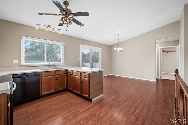 104 Maywood Ct, Saint Peters, MO 63376 - kitchen featuring dishwasher, vaulted ceiling, dark wood-type flooring, brown cabinetry, and a ceiling fan