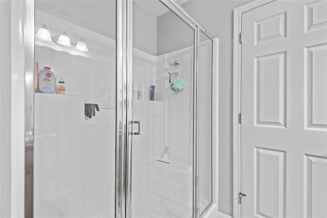 bathroom with a shower stall