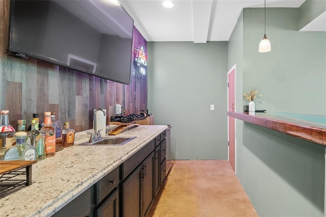 bar with a sink and pendant lighting