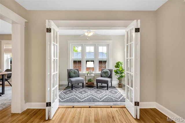 7439 Wellington Ave, University City, MO 63130 - living area featuring wood finished floors and a ceiling fan