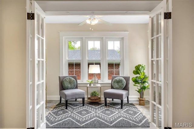 7439 Wellington Ave, University City, MO 63130 - living area with a ceiling fan, wood finished floors, and french doors