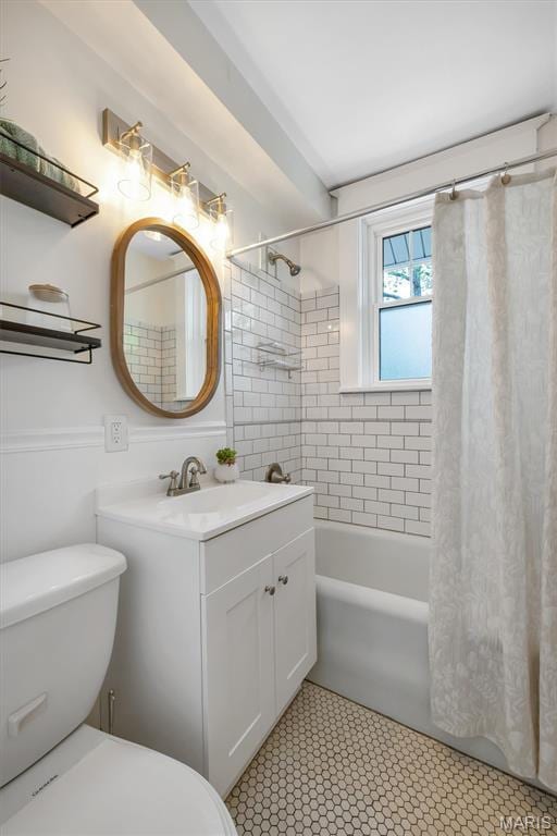 7439 Wellington Ave, University City, MO 63130 - full bathroom with vanity and shower / bath combo with shower curtain