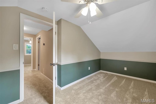 7439 Wellington Ave, University City, MO 63130 - additional living space with carpet, vaulted ceiling, and a ceiling fan