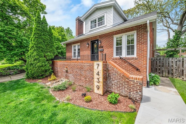 7439 Wellington Ave, University City, MO 63130 - view of front of house with brick siding and a chimney