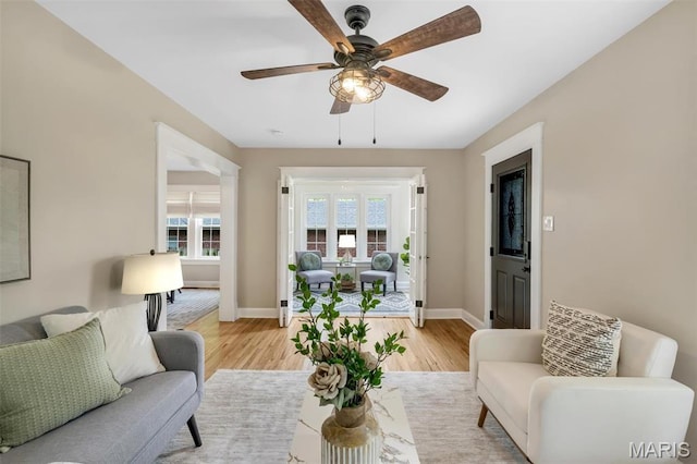 7439 Wellington Ave, University City, MO 63130 - living area with light wood-type flooring and a ceiling fan