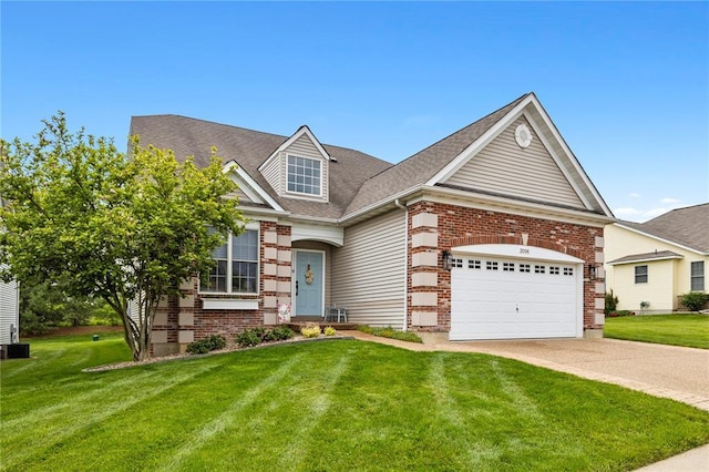 2056 Hawks Landing Dr, Lake St Louis, MO 63367 - view of front of house with brick siding, concrete driveway, and a front yard