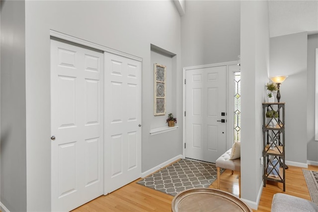 2056 Hawks Landing Dr, Lake St Louis, MO 63367 - entryway featuring light wood-type flooring, baseboards, and a towering ceiling