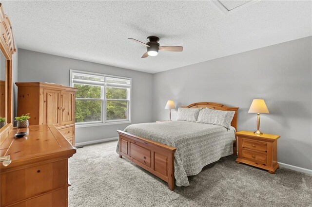 2056 Hawks Landing Dr, Lake St Louis, MO 63367 - bedroom featuring carpet floors, baseboards, a textured ceiling, and a ceiling fan