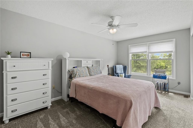 2056 Hawks Landing Dr, Lake St Louis, MO 63367 - bedroom with dark colored carpet, baseboards, a textured ceiling, and a ceiling fan