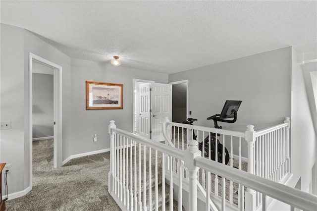 2056 Hawks Landing Dr, Lake St Louis, MO 63367 - corridor featuring an upstairs landing, carpet, a textured ceiling, and baseboards