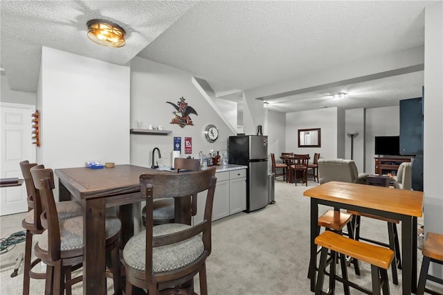 2056 Hawks Landing Dr, Lake St Louis, MO 63367 - dining space with light colored carpet and a textured ceiling