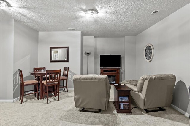 2056 Hawks Landing Dr, Lake St Louis, MO 63367 - living area with a textured ceiling, carpet floors, and baseboards
