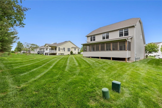 2056 Hawks Landing Dr, Lake St Louis, MO 63367 - back of property with a sunroom and a yard