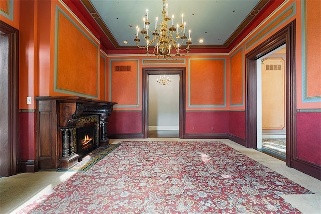 3534 Washington Ave, Saint Louis, MO 63103 - dining area featuring a chandelier, ornamental molding, carpet floors, and a lit fireplace