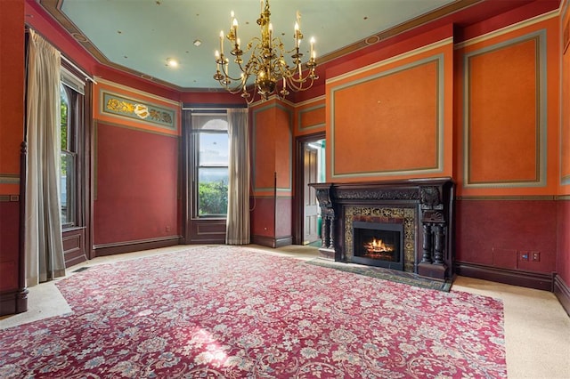 3534 Washington Ave, Saint Louis, MO 63103 - unfurnished living room featuring a chandelier, a high end fireplace, crown molding, and baseboards
