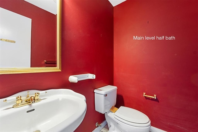 3534 Washington Ave, Saint Louis, MO 63103 - half bath featuring a sink and toilet