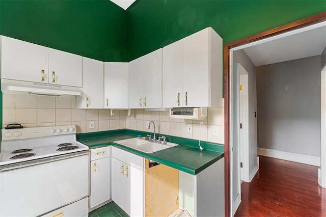 3534 Washington Ave, Saint Louis, MO 63103 - kitchen featuring electric stove, under cabinet range hood, a sink, backsplash, and white cabinetry