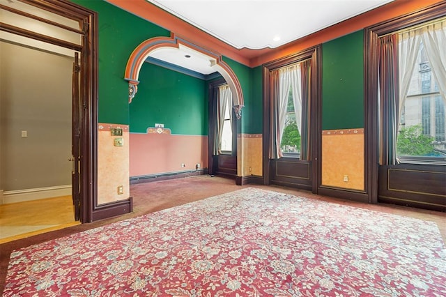 3534 Washington Ave, Saint Louis, MO 63103 - carpeted spare room with plenty of natural light, a baseboard radiator, and baseboards