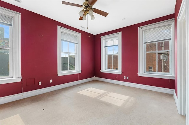 3534 Washington Ave, Saint Louis, MO 63103 - carpeted empty room featuring baseboards and a ceiling fan