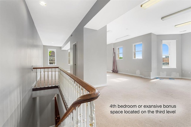 3534 Washington Ave, Saint Louis, MO 63103 - hall featuring carpet floors, an upstairs landing, and baseboards