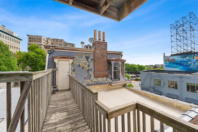 3534 Washington Ave, Saint Louis, MO 63103 - back of house with a chimney and a balcony