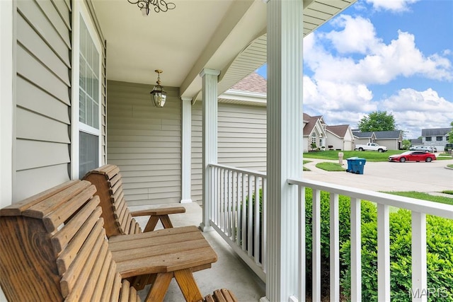 13116 Ambrose Ct, Black Jack, MO 63033 - covered porch featuring a residential view