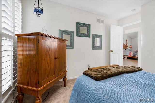 13116 Ambrose Ct, Black Jack, MO 63033 - bedroom featuring light colored carpet, multiple windows, and baseboards