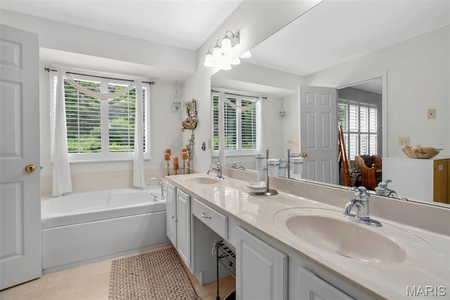 13116 Ambrose Ct, Black Jack, MO 63033 - full bathroom with double vanity, a garden tub, and tile patterned floors