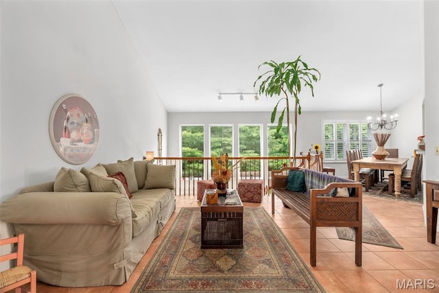 13116 Ambrose Ct, Black Jack, MO 63033 - living area with a chandelier and light tile patterned flooring