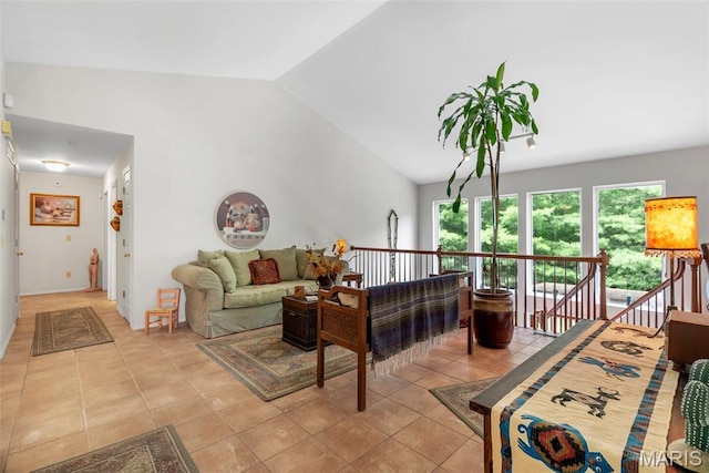 13116 Ambrose Ct, Black Jack, MO 63033 - living room featuring vaulted ceiling and light tile patterned floors