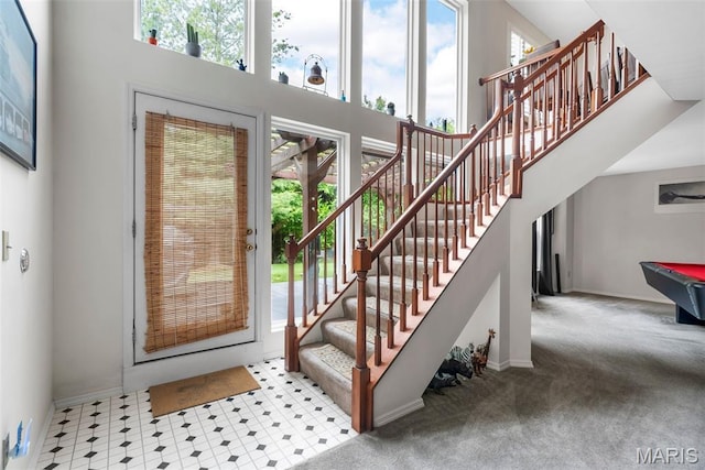 13116 Ambrose Ct, Black Jack, MO 63033 - foyer entrance with plenty of natural light, stairway, a towering ceiling, billiards, and baseboards