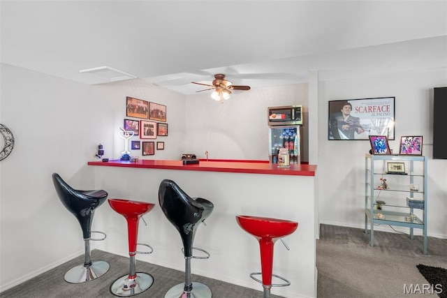 13116 Ambrose Ct, Black Jack, MO 63033 - indoor bar with ceiling fan, carpet, baseboards, and refrigerator