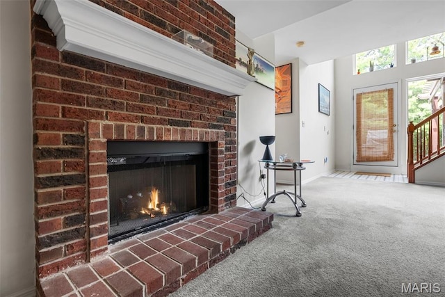 13116 Ambrose Ct, Black Jack, MO 63033 - detailed view of carpet floors, a fireplace, and baseboards